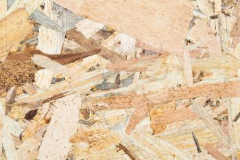 Wooden oriented strand board texture as a background.