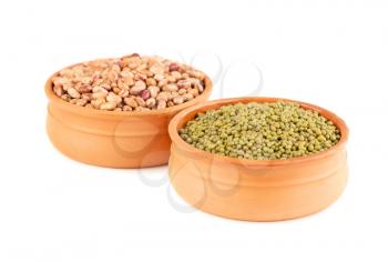 Borlotti and mung beans in the ceramic pots isolated on a white background.