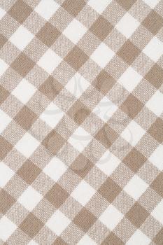 Beige and white kitchen towel texture as a background, vertical image.