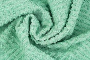Green towel texture as a background, horizontal picture.