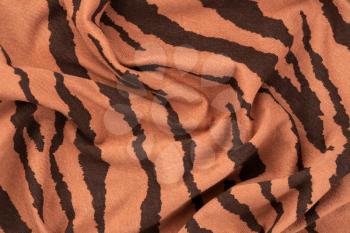 Brown fabric texture with pattern as a background.
