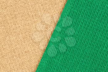 Green and beige kitchen towels texture as a background, horizontal image.