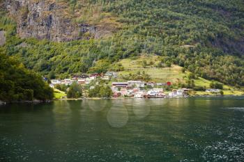 Landscape with Naeroyfjord, mountains and traditional village houses in Norway.