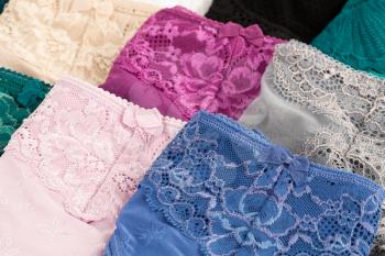 Many colorful panties close up picture.