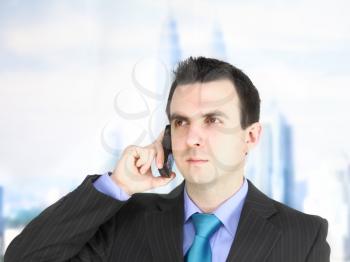 European businessman with cell phone. Isolated over white