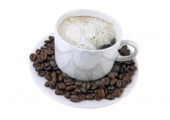 Cup of hot coffee on a white plateau and grains of coffee. Isolated.