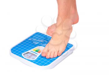 Man's legs , which weighed on floor scale. Isolated over white