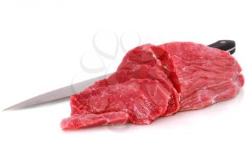 Cut of  beef steak  with knife  Isolated.