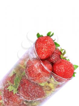 Fragment of glass with fresh strawberries and soda on white background. Isolated