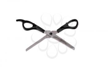 Jagged edges hairdressing scissors. Isolated over white