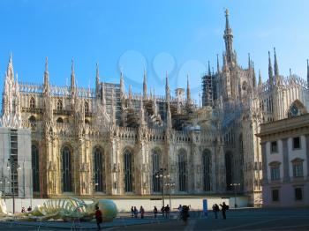 Cathedral Duomo  in Milan  at   left wing of Cathedral.  In front view a skeleton. Italy