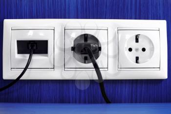 Plugs in electric and phone  socket