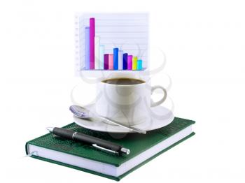 Coffee cup, standing on the personal organizer, on a back background-financial diagrams . Isolated