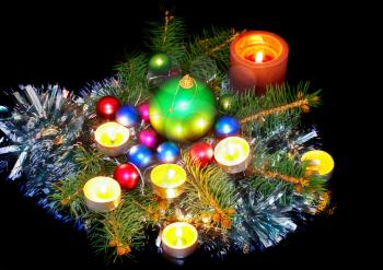  New Year decoration- balls, tinsel, candel .On black background