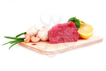Beef steak  on meat hardboard with mushroom  and lemon. Isolated.