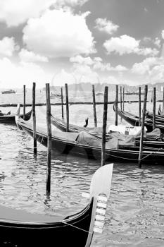 Gondolas near Doge's Palace, Venice, Italy. Black-white