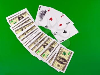 Four aces and dice on green broadcloth (background).