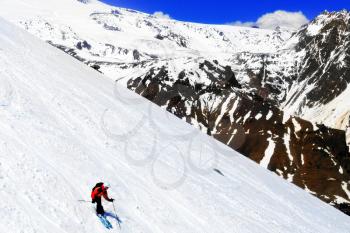 A skier descending Mount Elbrus - the highest peak in Europe.
