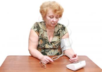 Senior lady measures arterial pressure , use digital tonometer . Isolated.