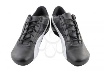 Leather black sneakers on white. Isolated over white.