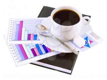 Coffee cup, standing on the personal organizer, on a back background-financial diagrams . Isolated