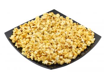 Plate with fresh caramel popcorn. Isolated. Close-Up. Isolated