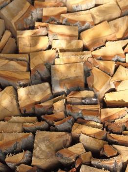 Firewood combined in a woodpile stack.