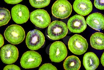 Abstract  slice of kiwi on black background(as wallpaper or backdrop).