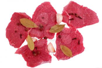 Cut of  beef steak  with  laurel, garlic and  flavouring. Isolated.