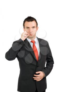Cheerful young businessman be in a world by oneself- show gesture close mouth. Isolated