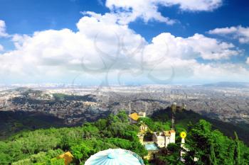 Panorama view on Barcelona city from mountain top Tibidabo. Spain