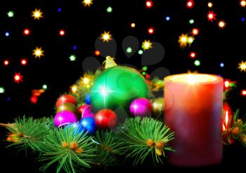  New Year decoration- balls, tinsel, candel .On black background