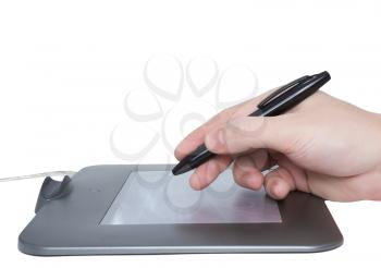 Pen tablet and draw hand. Isolated over white.