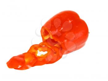 Cutting red sweet pepper. Isolated over white