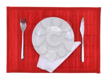 Table serving-knife,plate,fork and silk napkin  on  various colour background.