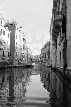 Classic view of Venice with canal and old buildings, Italy, black-white