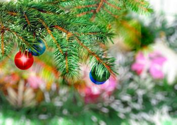 Christmas and New Year decoration- glass balls, green tinsel . Close-Up. On white background, isolated.