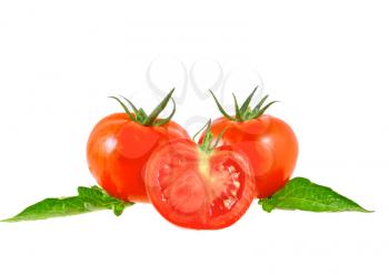 Lush tomatos with green leafs. Isolated over white