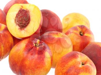 A few peaches with slice of one, on white background. Isolated