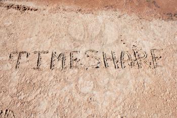 Inscription TimeShare on a sand n a  beach.