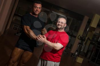 handshake of bodybuilder and training partner