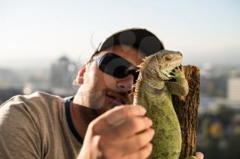 portrait of the young man with the iguana