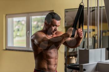 shirtless bodybuilder preparing for his exercise