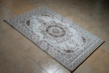 White Persian Rug Isolated On Tiles