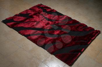 Single Red Carpet Folded On Floor