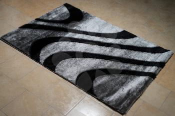 Black Carpet Lying On Floor
