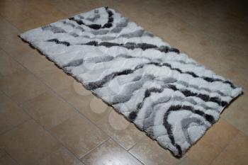 White Carpet Lying On Floor