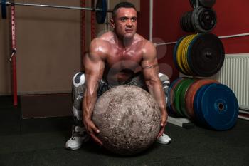 Bodybuilder Trying A Strongman Exercise