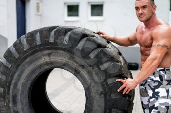 Muscular Man Resting After Tire Workout