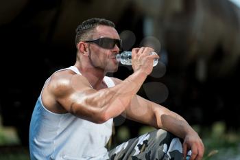 Man Drinking Water After Exercise